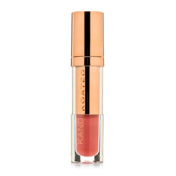 A closed clear and rose gold tube of Lacquer Lip Cream in “Girl Talk”, a warm dark pink with coral tones. The tube has Kandi Koated written up the side in rose gold letters and a rose gold cap.